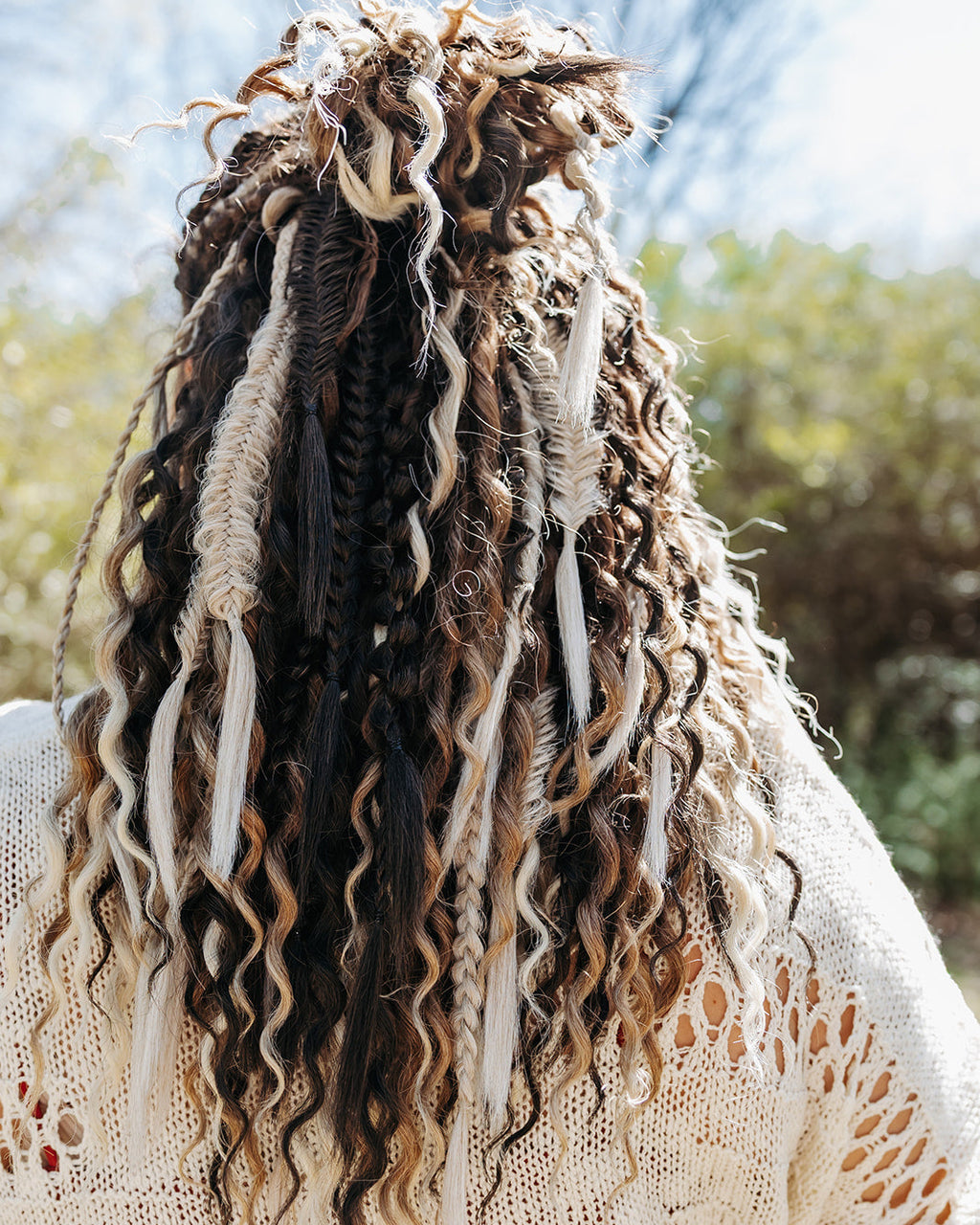 Styled braid in extensions with Luma Bundle accents in highlights and lowlights