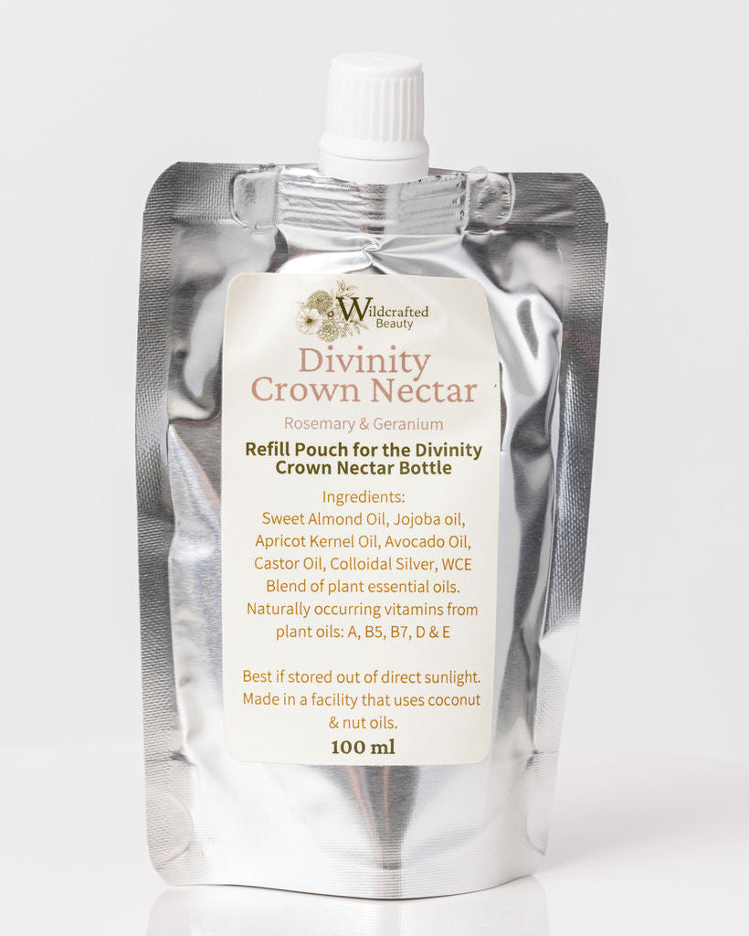 A pouch labeled 'Divinity Crown Nectar' for refilling hair moisturizing serum, with a white and silver design.