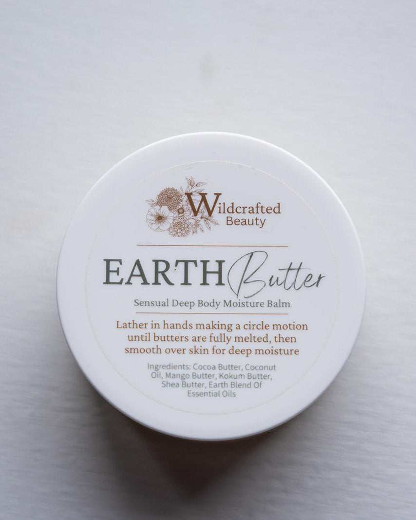 Container of Earth Butter by Wildcrafted Beauty on a light gray background
