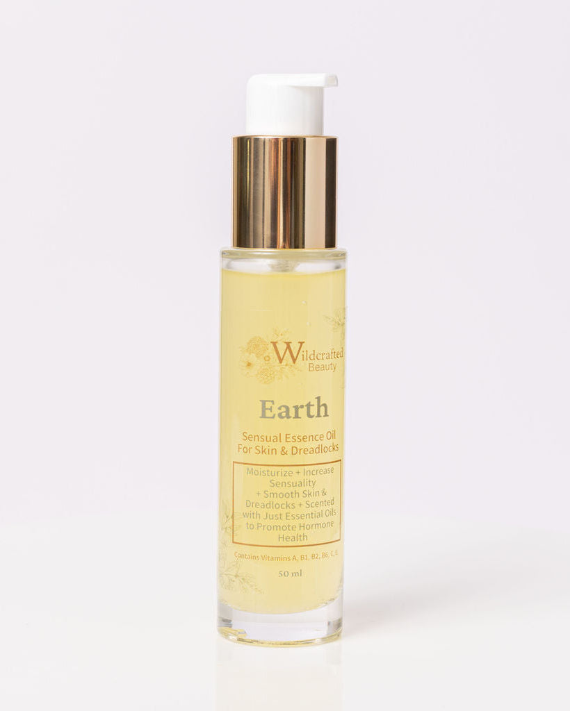 A clear bottle with yellow liquid, labeled 'Earth - Sensual Moisturizing Body Oil'