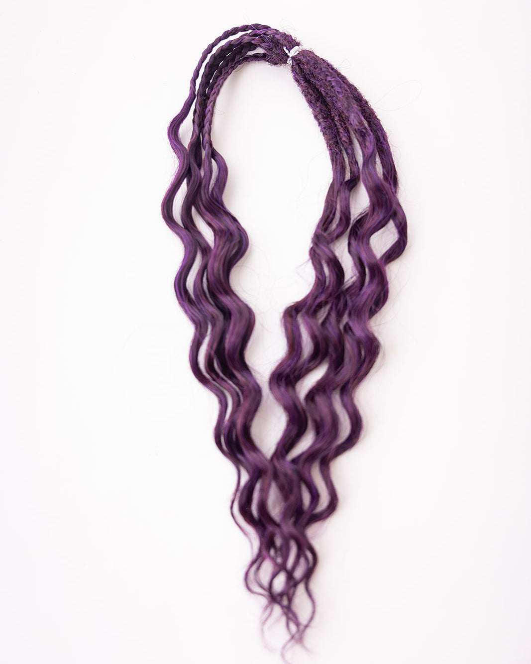 Purple wavy synthetic braiding hair extensions with a textured, twisted finish, displayed against a plain white background.