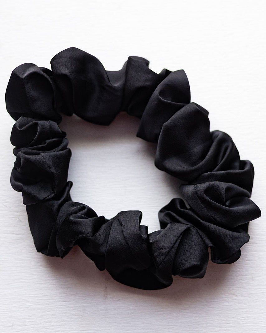 Black scrunchie on a white background