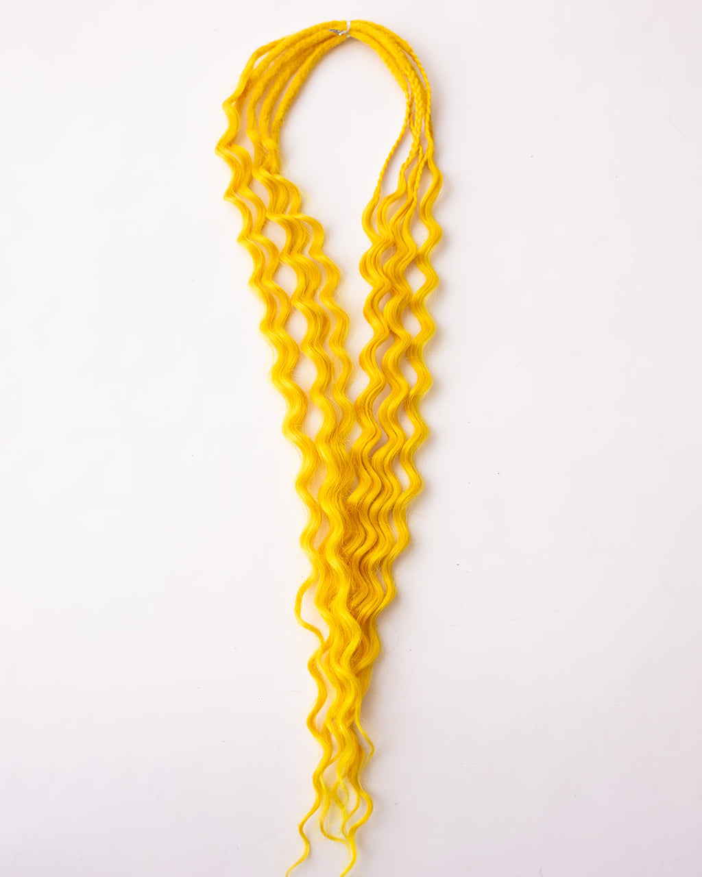 Bright yellow synthetic curly braid extensions hanging against a plain white background.