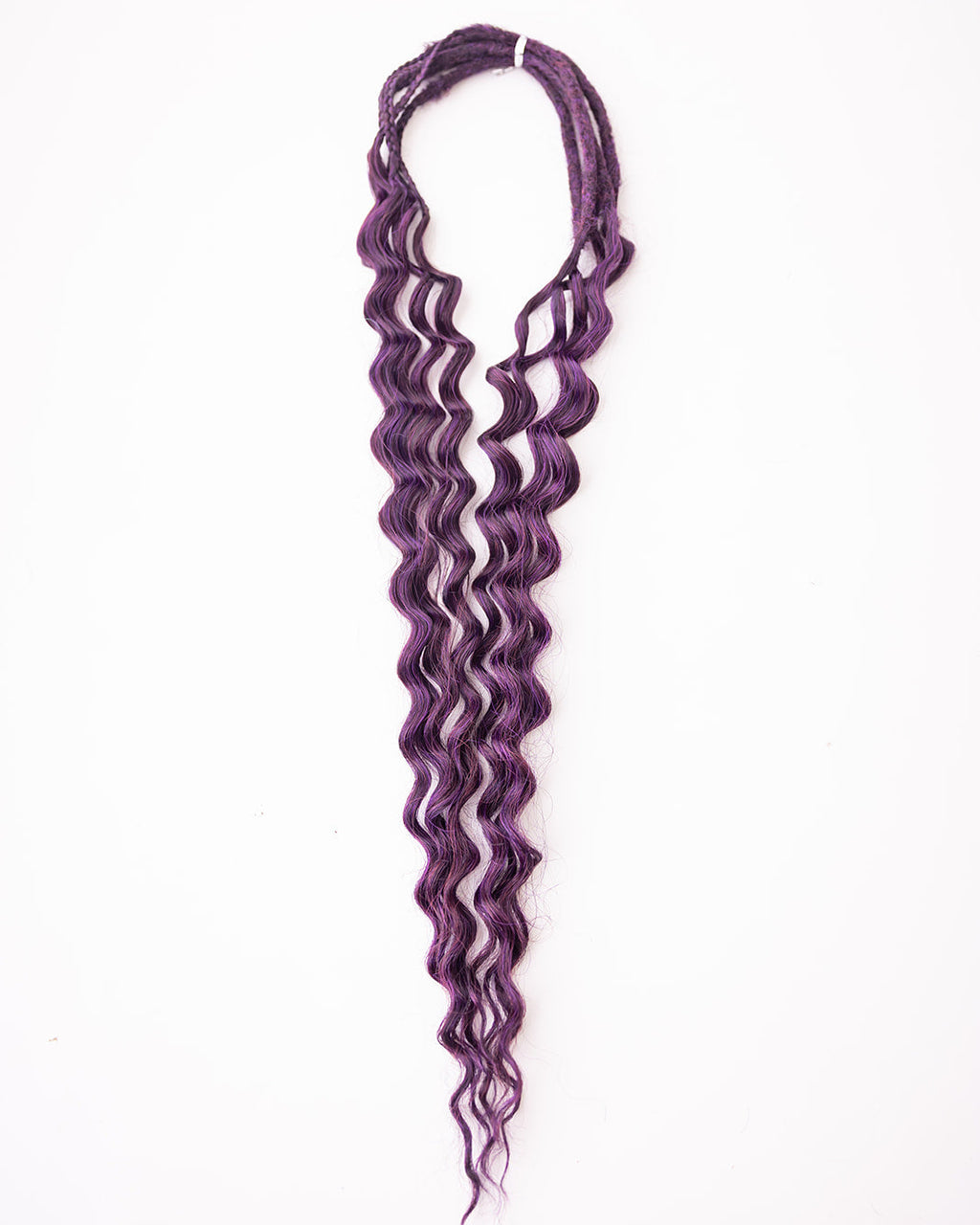 Purple wavy synthetic hair extensions, displayed against a plain white background.