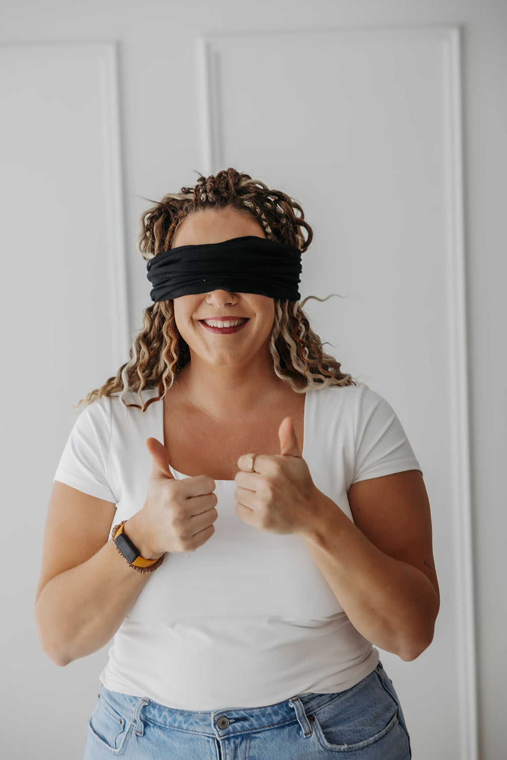 Girl wearing a midnight ona band by wildcrafted beauty as a blindfold